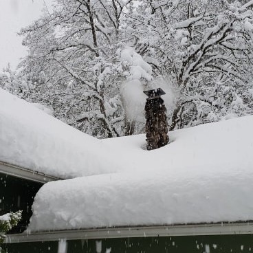Snow on a roof in Gig Harbor, WA